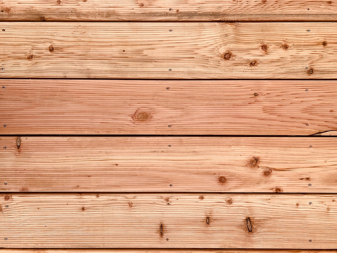brown wooden plank with white and black paint